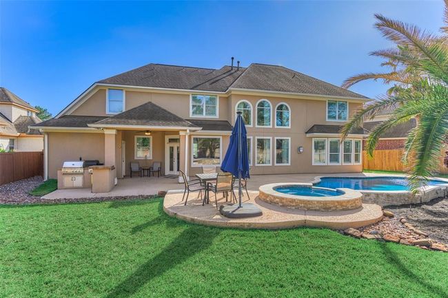 Relax and unwind in your new home, featuring a spacious yard perfect for outdoor enjoyment. | Image 32