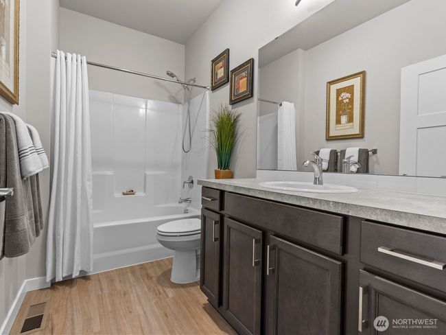 Just down the hall is a full bathroom, conveniently located for guest access. | Image 5