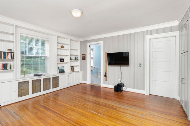 This could serve as a study, library or as a main floor bedroom. There is a private bath attached which has zero entry shower. | Image 31