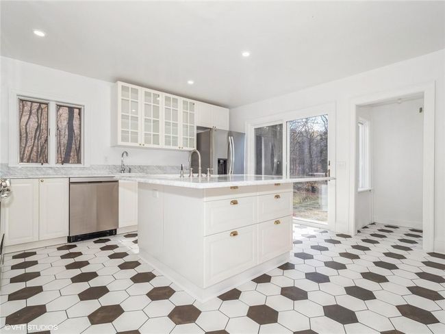 The main floor also features a laundry and utility room. | Image 28
