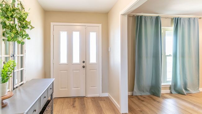 Foyer with a wealth of natural light, light wood-type flooring, and baseboards | Image 6