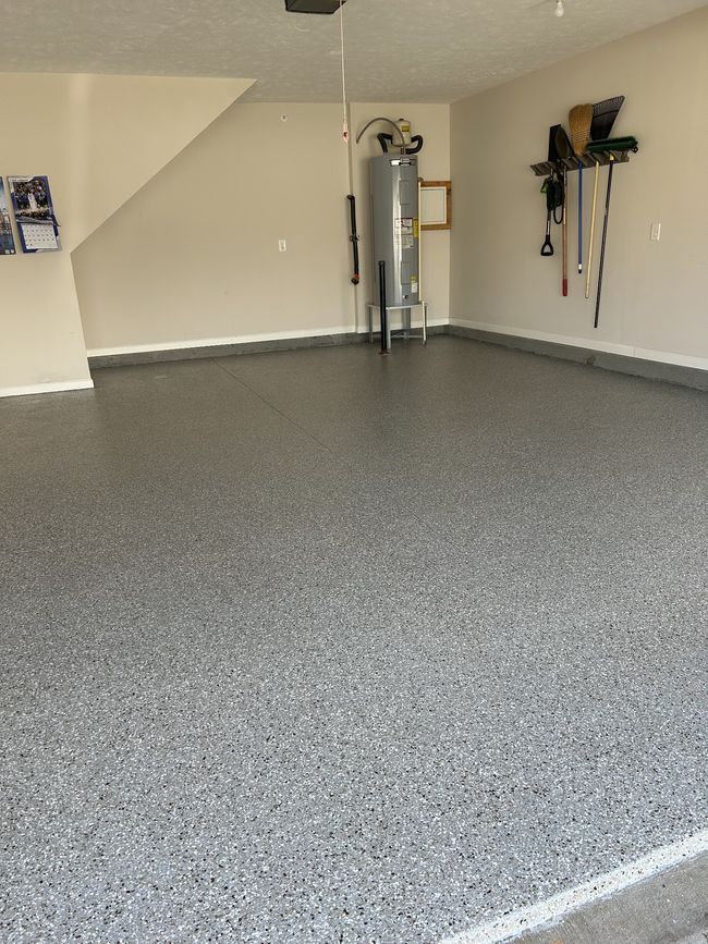 Immaculate garage with epoxy floor and lots of storage area. | Image 35