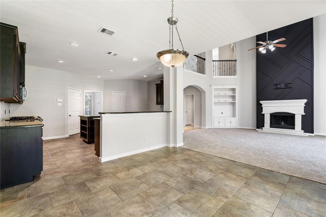 Alternative view of living room/ kitchen and breakfast area. | Image 9