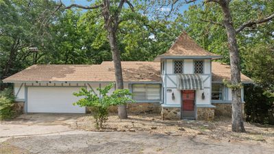 View of front of house with a garage | Image 1