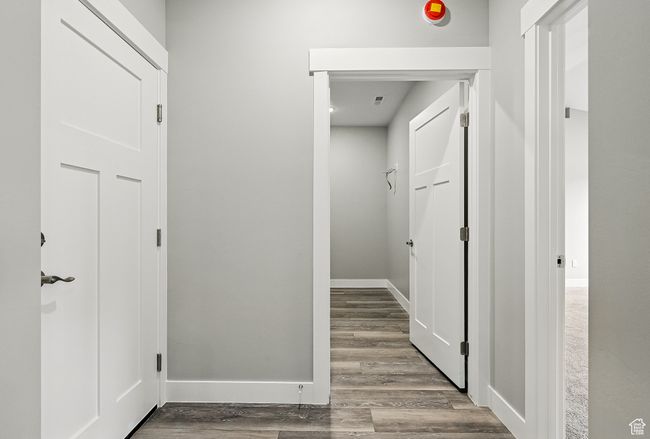 Hall with wood finished floors and baseboards | Image 23