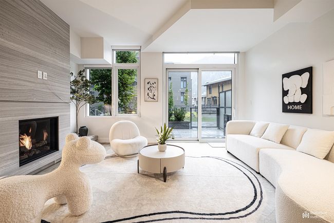 Living room featuring a fireplace | Image 4