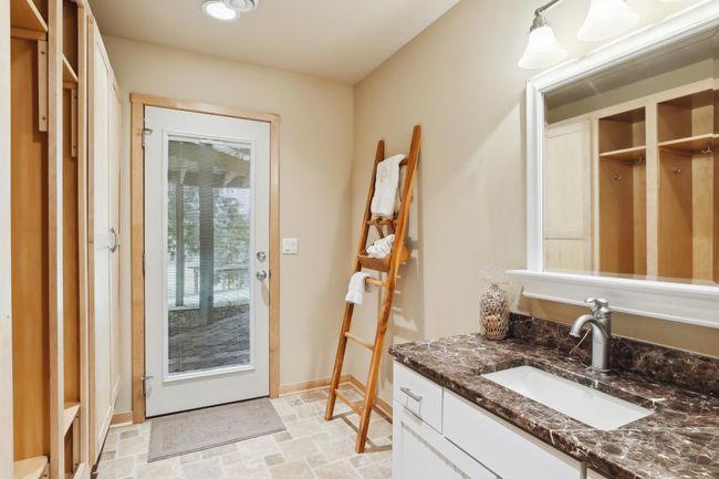Enjoying the lake and super easy access from outside to the lower level to the bathroom! Thoughtfully planned for endless lake days and memories on the shoreline. | Image 51