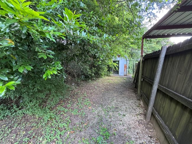 View of yard featuring a storage shed | Image 7