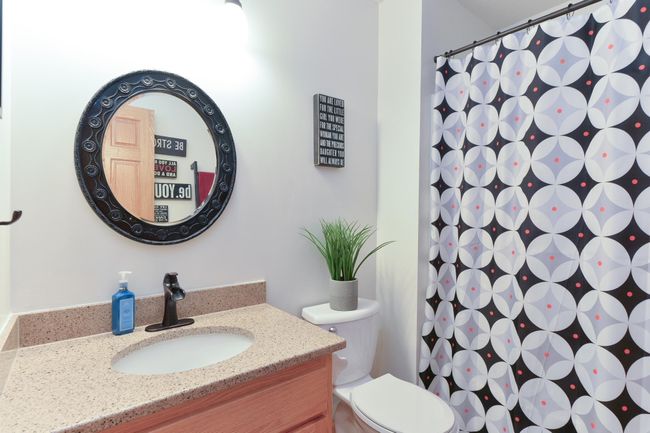 Upper Level full bath with tile floors and quartz vanity top | Image 20