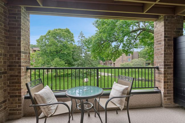 Lovely balcony off living room with serene views of mature trees, water feature, wildlife... | Image 8