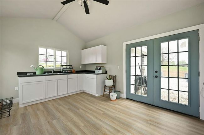 An absolute charming outbuilding. French double doors lead to the garden. | Image 53