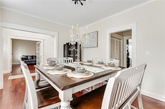 Dining space featuring ornamental molding, baseboards, and wood finished floors | Image 9