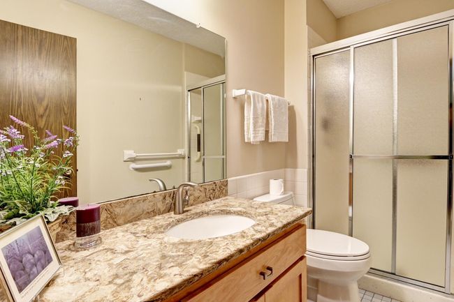Updated bedroom suite bath with tubular skylight | Image 17