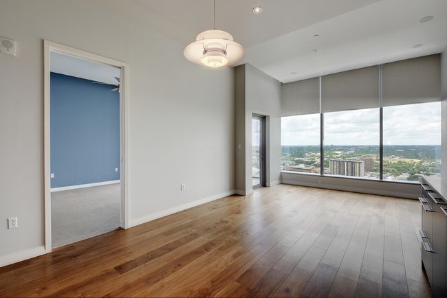 Spare room with wood-type flooring, baseboards, and recessed lighting | Image 4