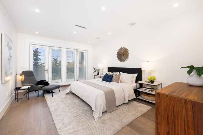 Bedroom featuring recessed lighting, visible vents, light wood-style flooring, and access to exterior | Image 21
