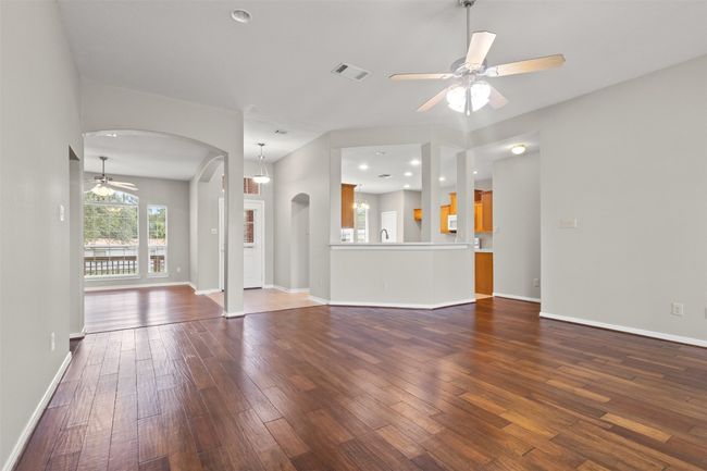 Looking from living room to kitchen and front door. | Image 10