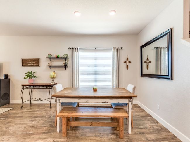 Dining room with wood finished floors | Image 8