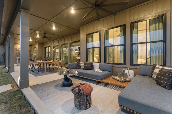 The staged patio shows how the various areas can be utilized with varied furniture placement. | Image 34