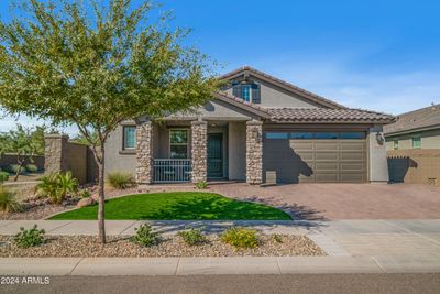 Adjacent to Open Common Space, Professionally Landscaped with Artificial Turf and Paver Driveway | Image 1