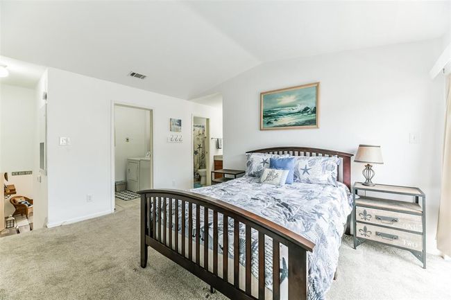 Full bathroom and personal laundry room reside in the primary bedroom. | Image 15