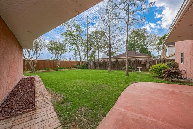 This extended stained concrete patio is ready for BBQ's | Image 48