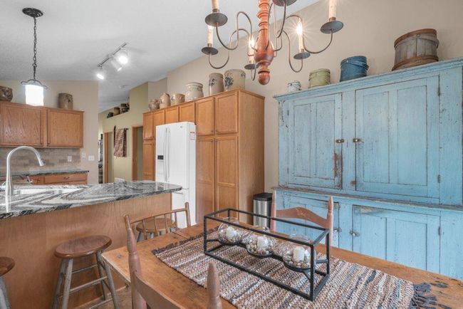 Ceramic tile flooring in the kitchen compliments the Australian Chestnut Flooring throughout the remainder of the main level. The Kitchen flooring was replaced 8-10 years ago while the Australian Chestnut flooring was replaced about 9-10 years ago. | Image 9