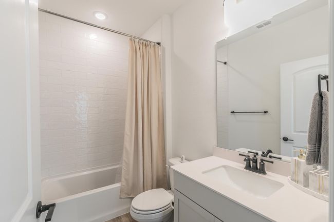 Full bathroom with shower / bath combo, vanity, and toilet | Image 21