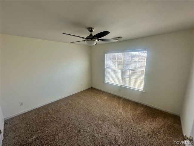 Spare room with ceiling fan and carpet flooring | Image 12