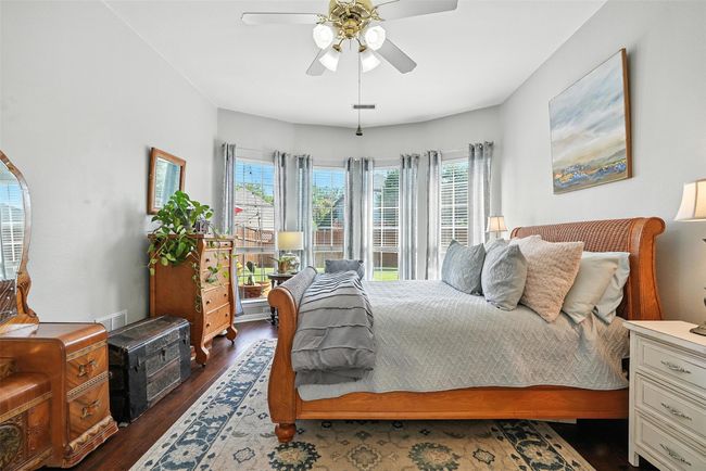 Bedroom featuring dark wood finished floors and a ceiling fan | Image 16