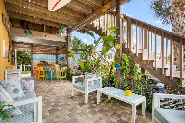 OUTSIDE PAVED PATIO WITH COVERED BAR | Image 56