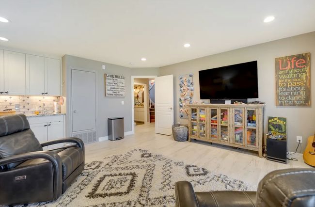 Living area with recessed lighting and wood finished floors | Image 12