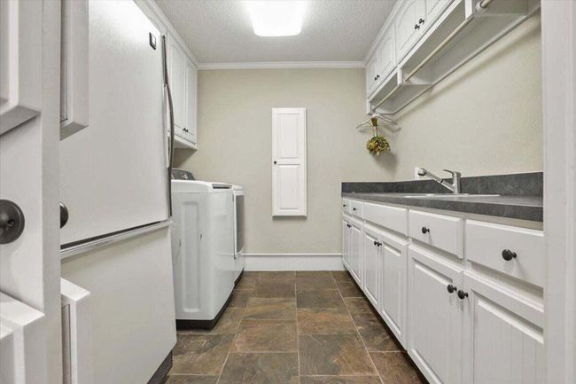 Laundry area with Sink & Storage | Image 37