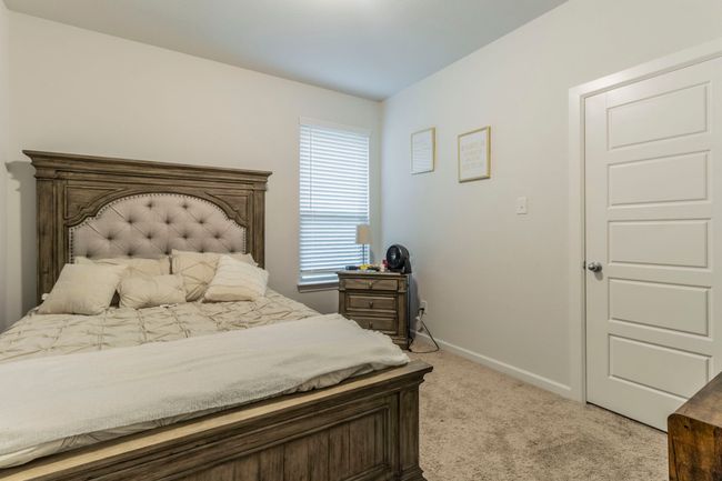 Bedroom with carpet flooring and baseboards | Image 11