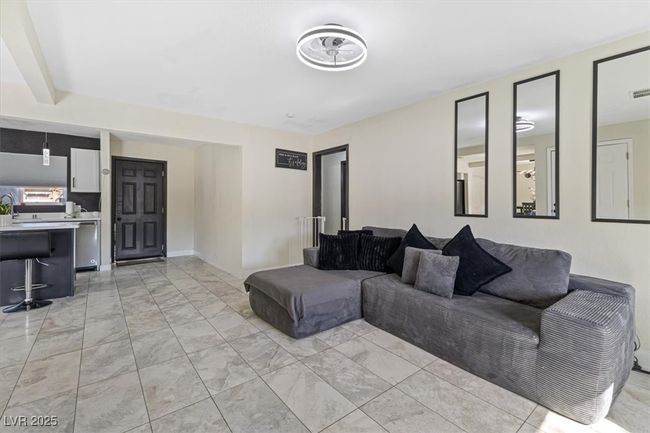 Living room featuring visible vents and marble finish floor | Image 9