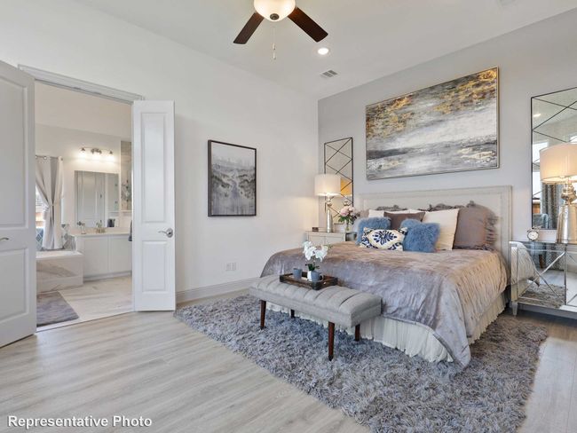 Bedroom with baseboards, visible vents, recessed lighting, wood finished floors, and connected bathroom | Image 8
