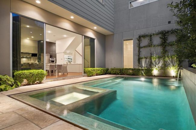 Fabulous night shot of this Backyard oasis! - such dramatic lighting on the side facade wall and surrounding landscape. | Image 38