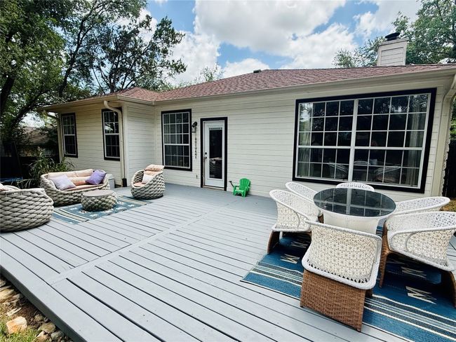Wooden deck featuring outdoor lounge area and outdoor dining space | Image 24
