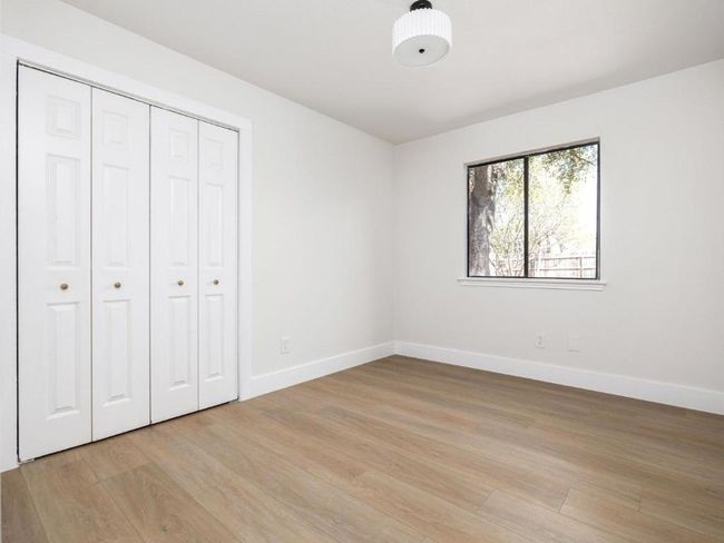 Unfurnished bedroom featuring a closet, baseboards, and light wood-type flooring | Image 19