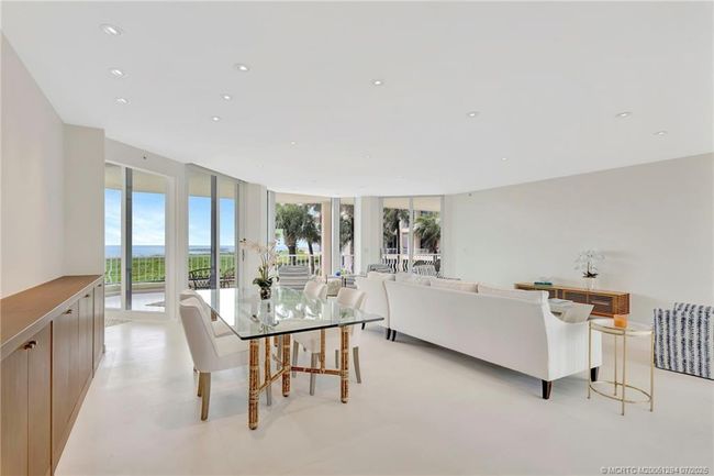 Spacious living/dining room with limestone floors | Image 13