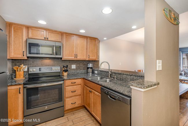 Updated Kitchen with Maple Wood Soft Close Cabinetry, Granite Countertops, Stainless Steel GE Appliances including Refridgerator, Dishwasher, Microwave, Electric Range & Oven | Image 10