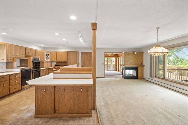 Living room w/2 sided fireplace and kitchen | Image 11