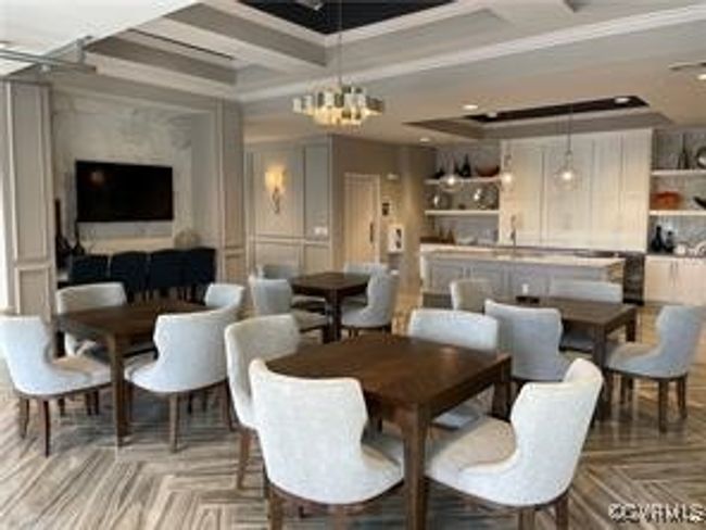 Dining area featuring ornamental molding and an inviting chandelier | Image 13