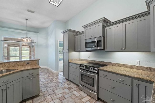 7008 Turnberry Cir, House other with 4 bedrooms, 2 bathrooms and 3 parking in Navarre FL | Image 29