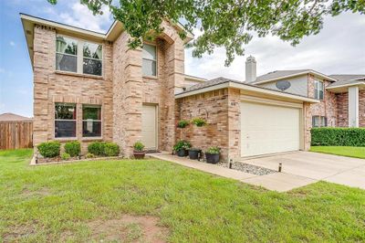 View of front facade featuring a garage and a front lawn | Image 3