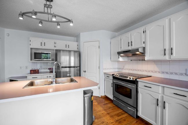 240 Arbour Ridge Way Nw, House other with 6 bedrooms, 4 bathrooms and 4 parking in Calgary AB | Image 11