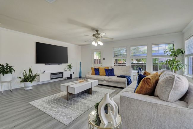 Living room with ceiling fan and hardwood / wood-style floors | Image 16