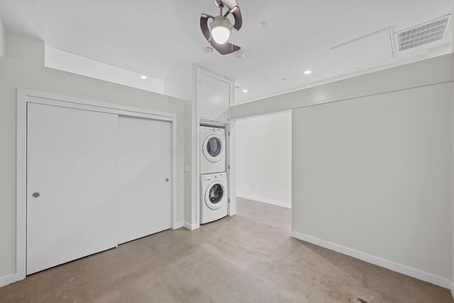 Bedroom with closet, laundry closet, and ceiling fan | Image 17