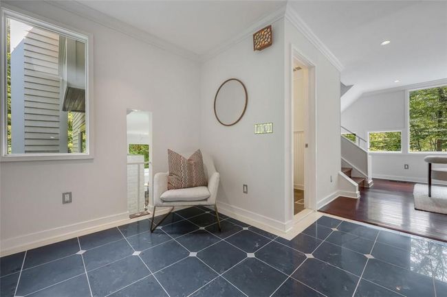 Such an attractive foyer entrance with porcelain tile flooring | Image 5