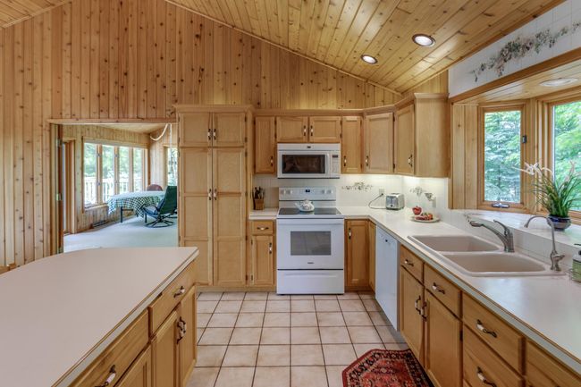 Kitchen/dining area lead out to the lakeside four season porch! | Image 16