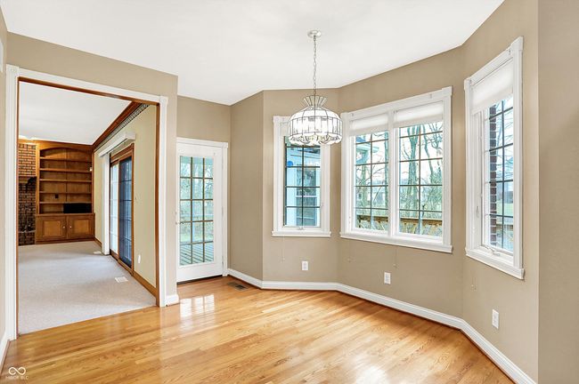 Casual dining area looking to Great Rm and door to screened in patio. | Image 17